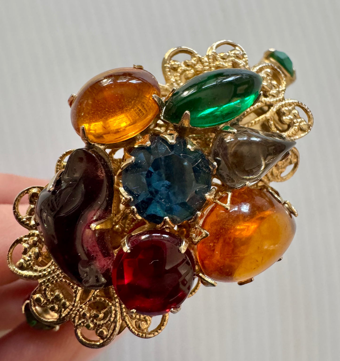 gorgeous, gold tone, vintage clamper bracelet with multicolor rhinestones. Sourced in Paris.