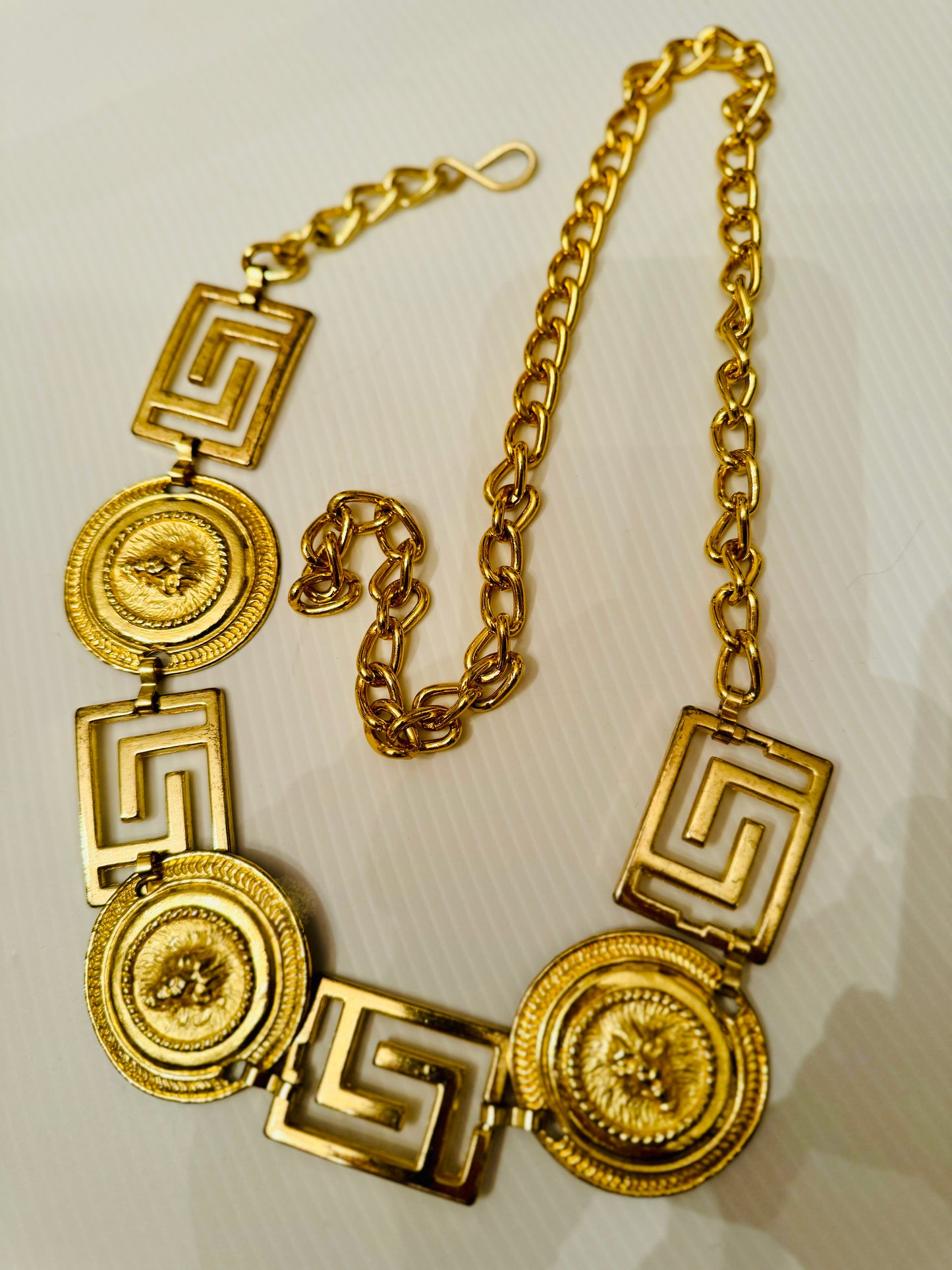 Vintage 1980s gold tone medallion belt with lion heads
