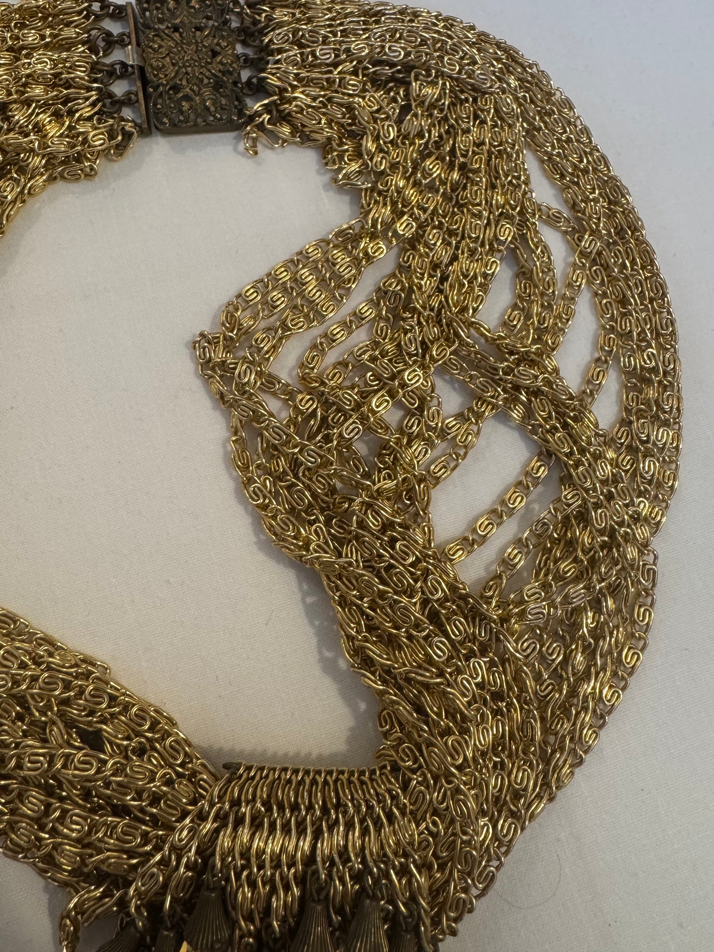 show stopping gold tone, vintage multi chain necklace with dangle rhinestones. Such a statement piece. Sourced in Paris.