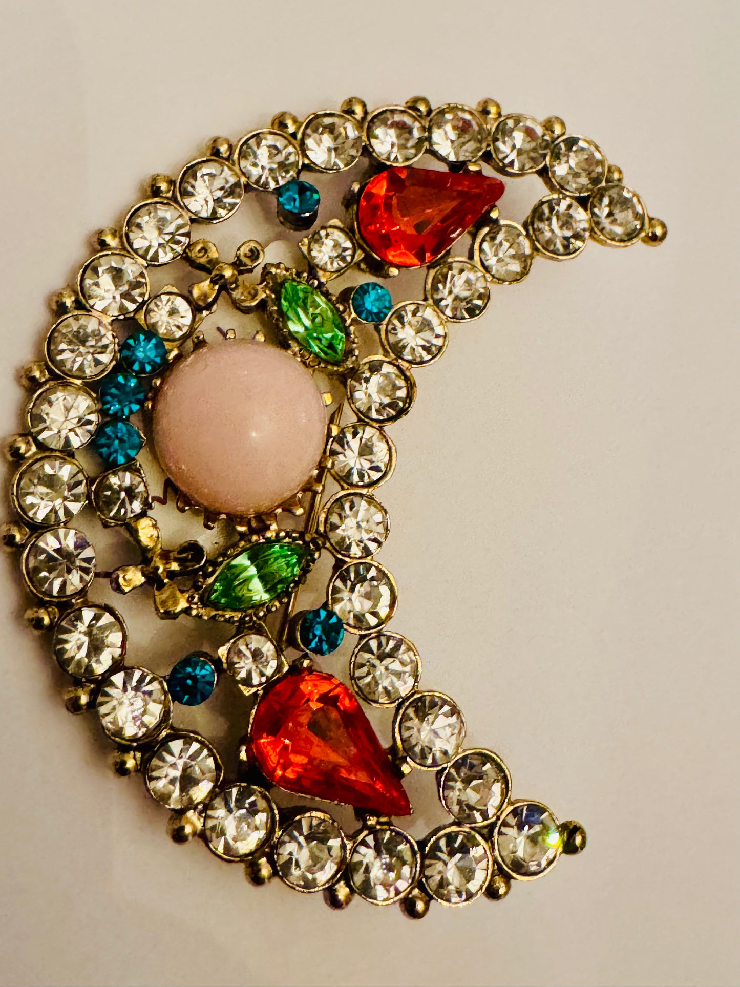 Vintage crescent moon with colorful rhinestones and uranium green stones