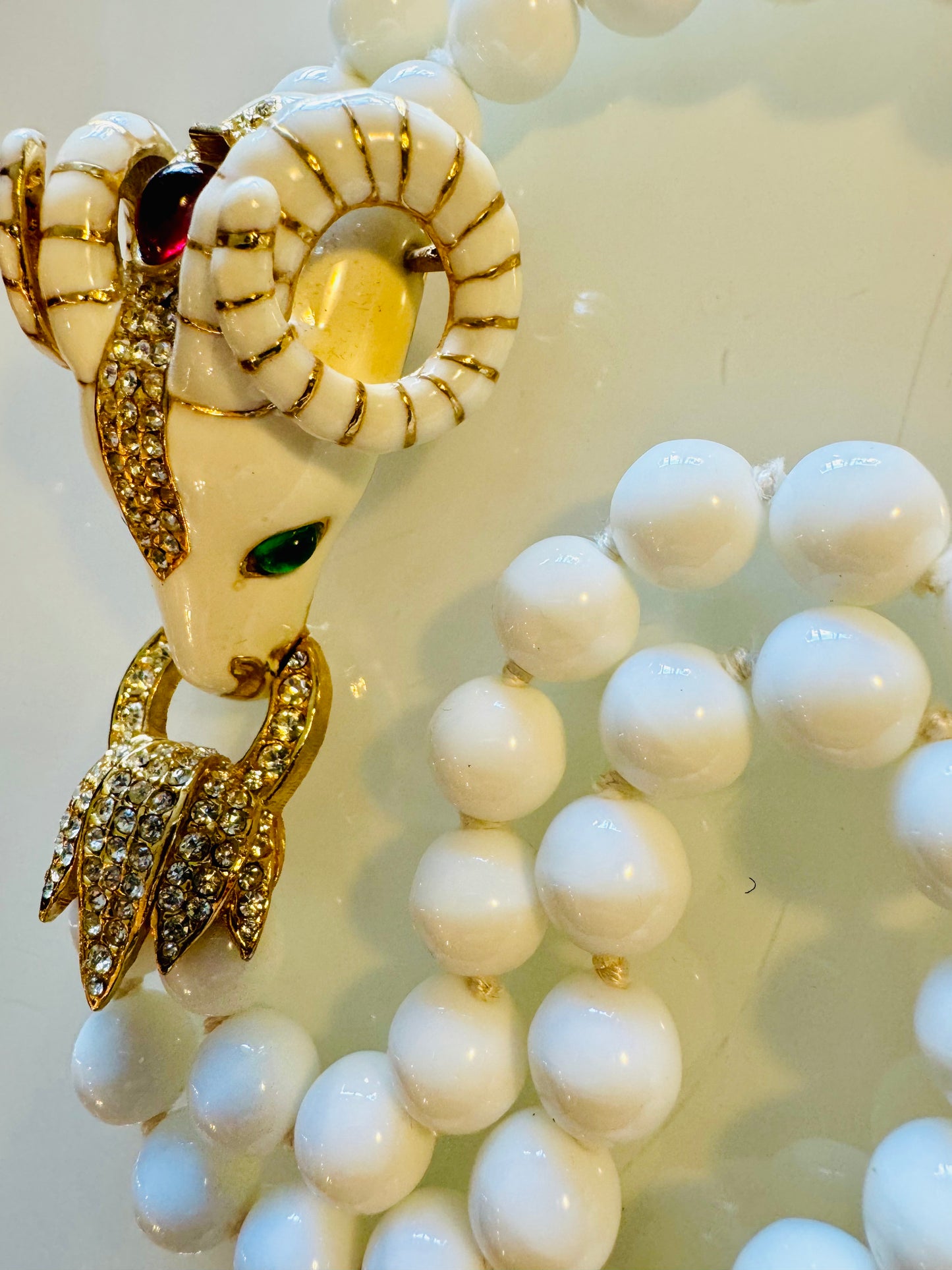 Vintage signed CINER 2 strand RAM necklace with crystal cabochon and hand knotted white glass pearl
beads