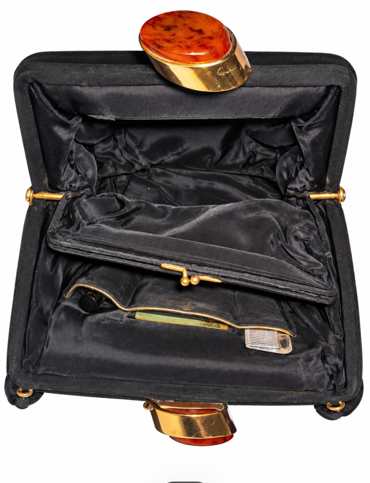 Beautiful 1940s black felt and bakelite kiss lock top handle bag. Inside has original mirror,comb and fragrance bottle