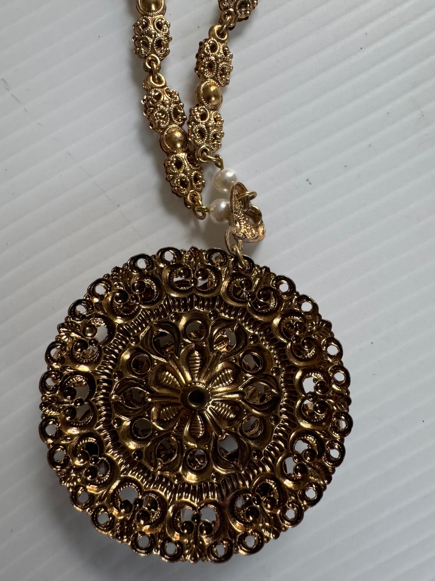 Gorgeous 1940s cameo necklace with pearl and rhinestone frame and delicate pearl closure. Sourced in Paris.