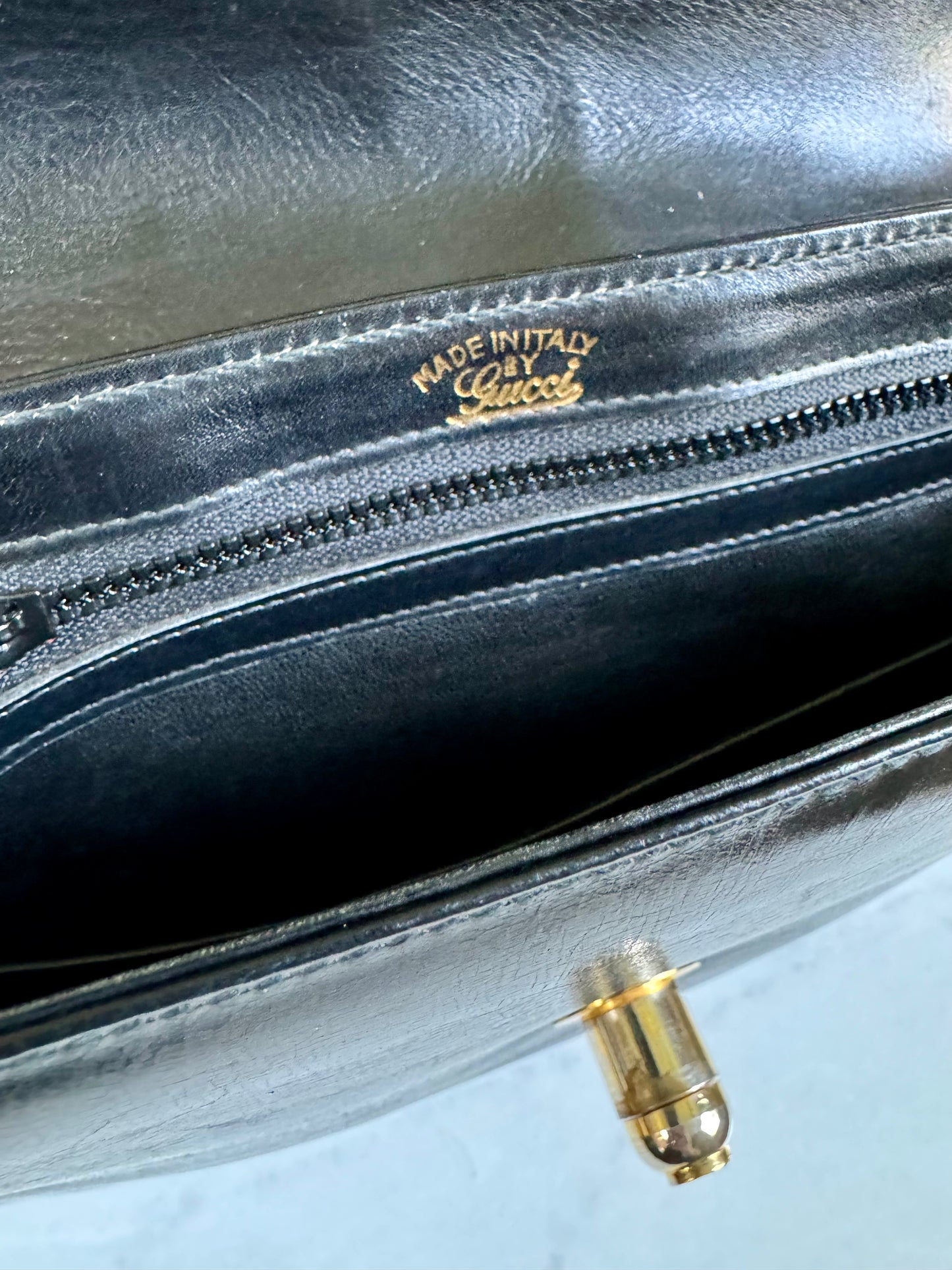 Vintage black 1970s leather Gucci top handle with gold clasp and hardware. Don't hesitate because this Baby will be gone quickly!