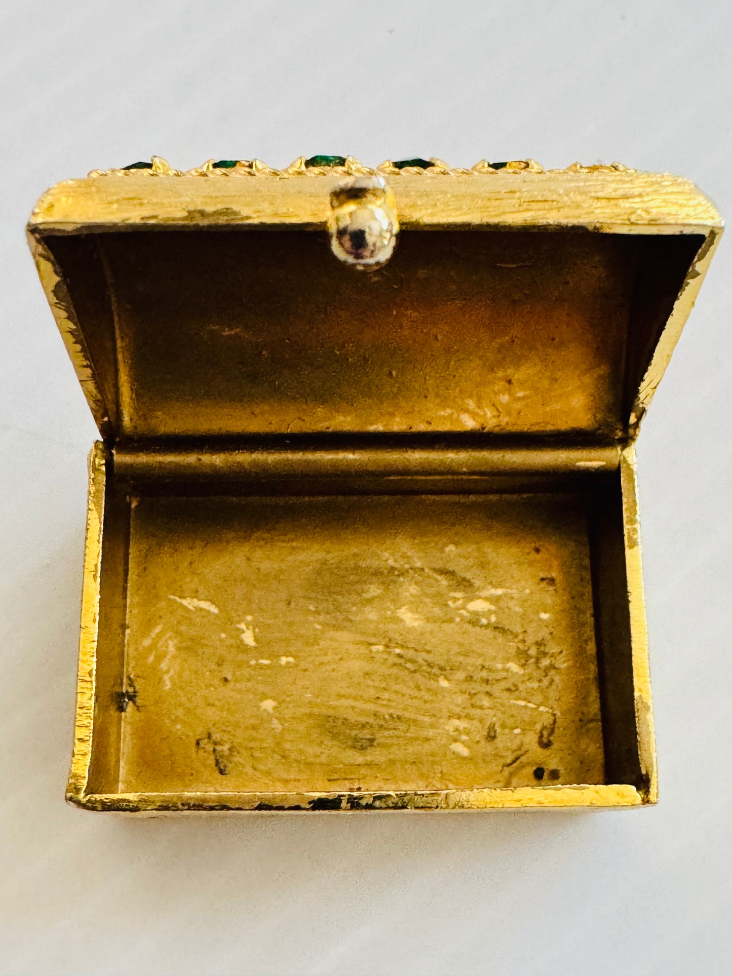 Stunning gold tone, mini trinket box with green rhinestones. sourced in Paris.