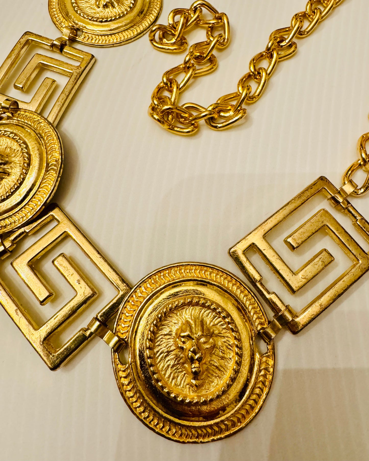 Vintage 1980s gold tone medallion belt with lion heads