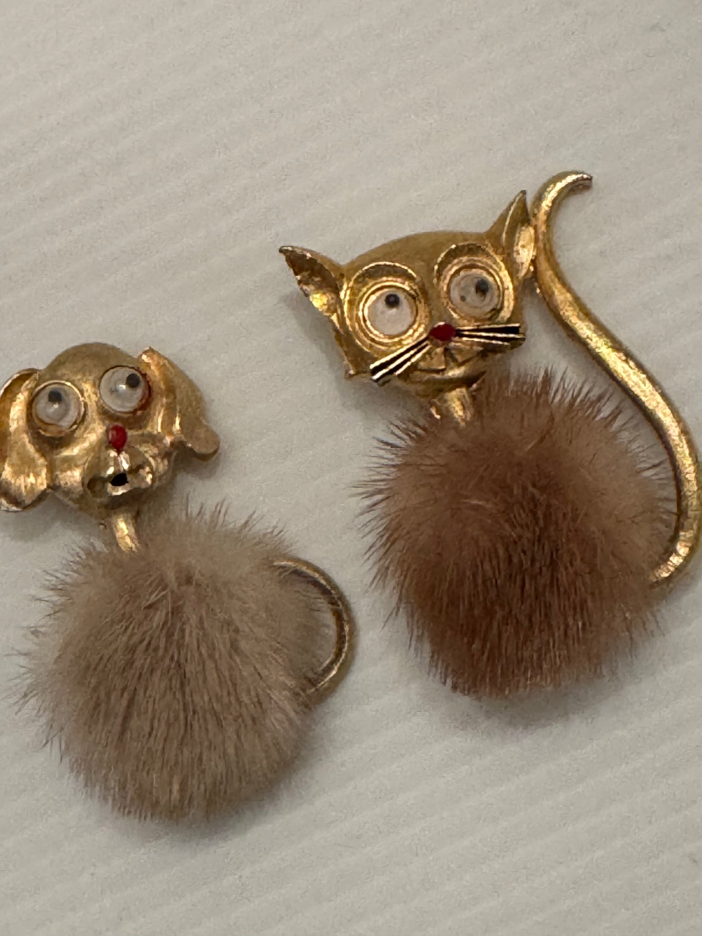 Adorable 1960s googly eye gold tone cat brooch with min body. Also available is a matching doggie.