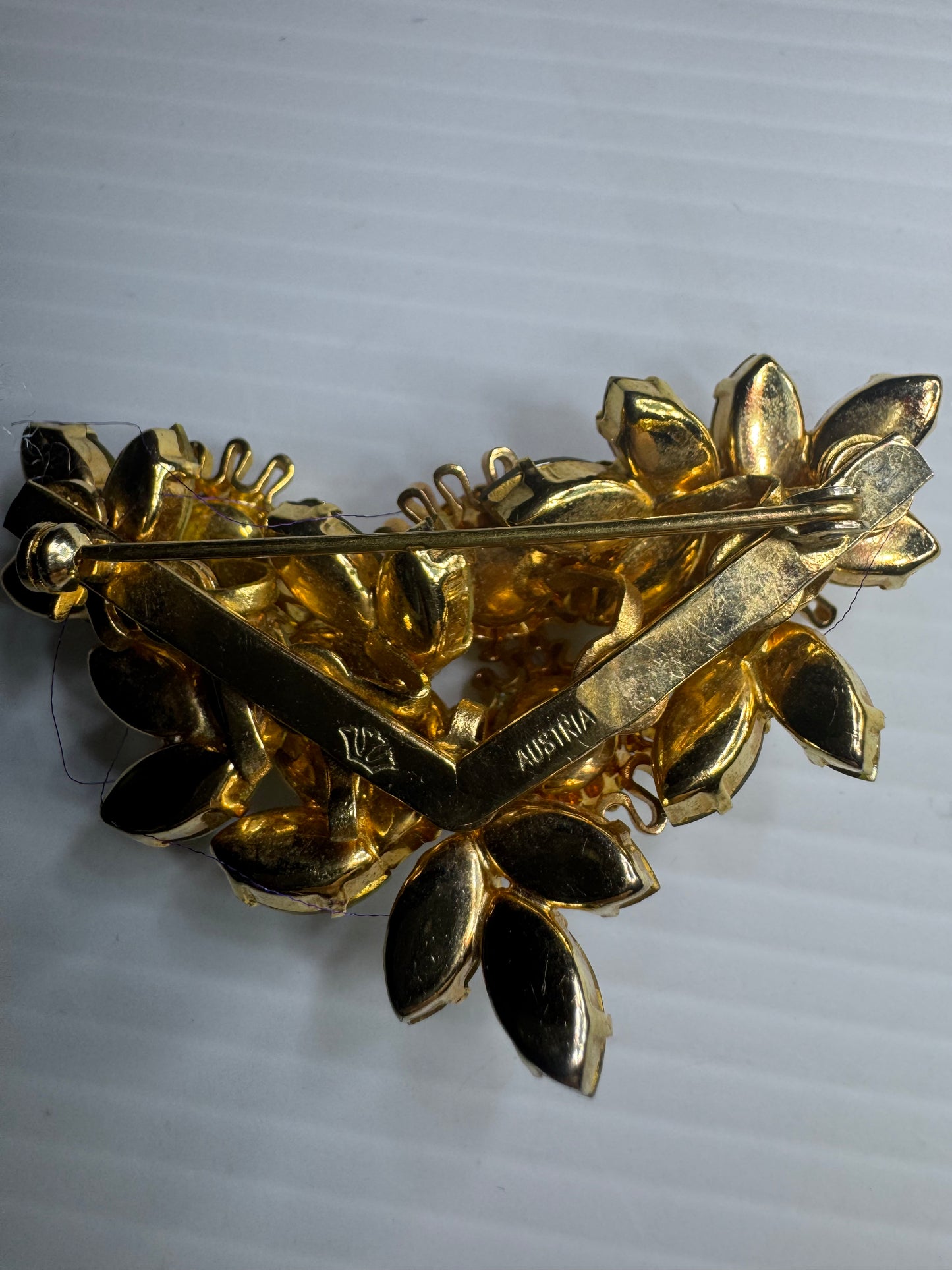 1940s signed Austria flower brooch with green and yellow navettes