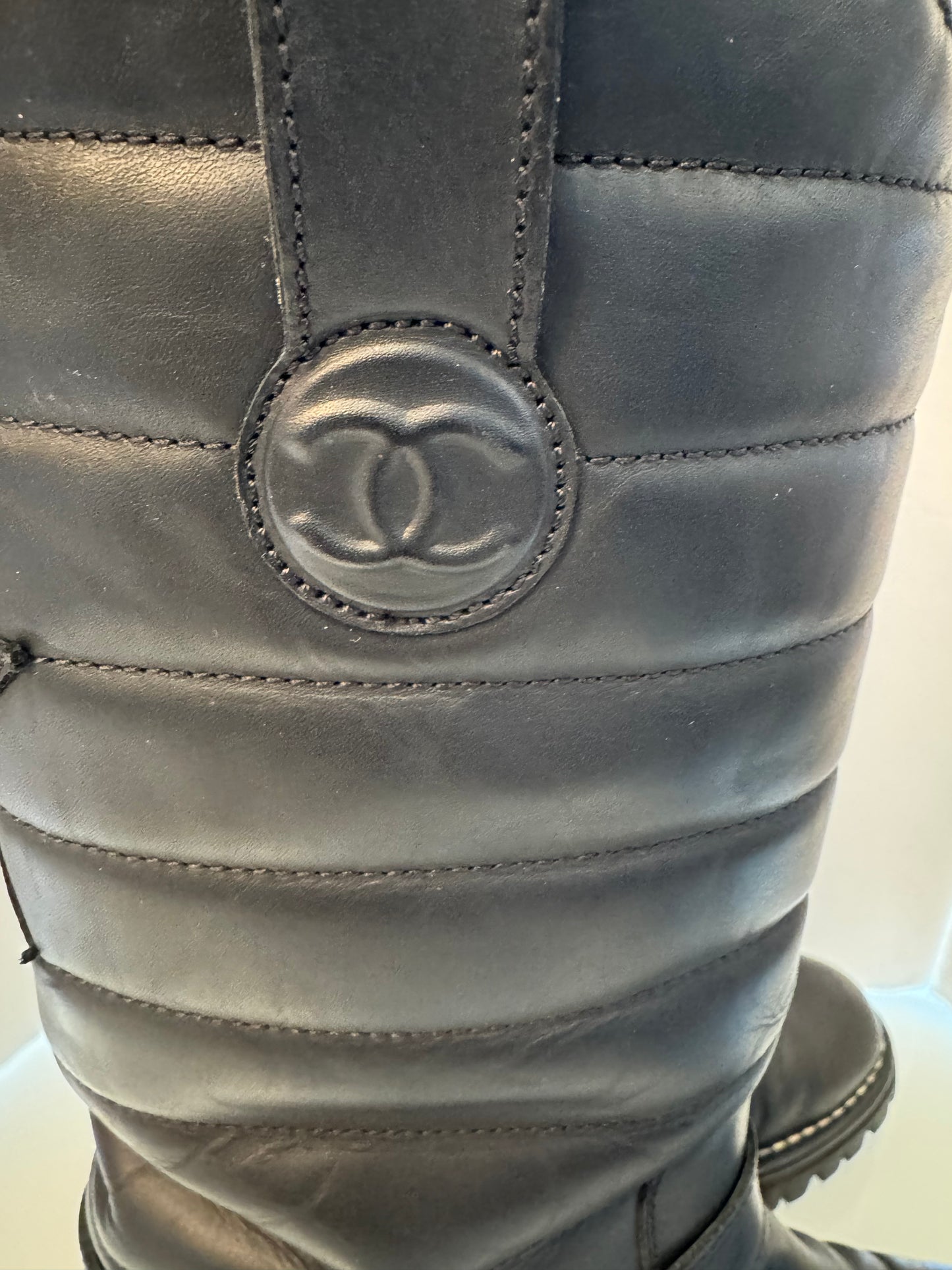 Chanel black leather moto boot with silver hardware and new vibram lug soles