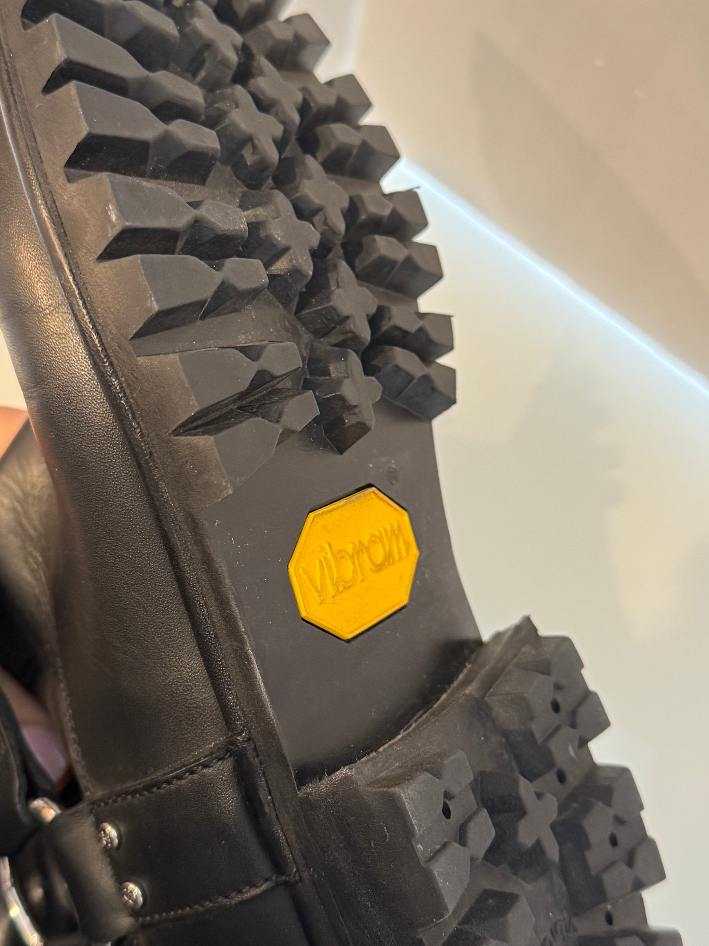 Chanel black leather moto boot with silver hardware and new vibram lug soles