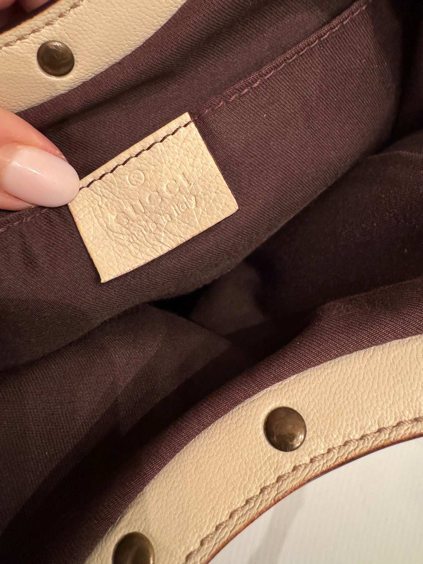 Vintage ivory leather GUCCI bag bronze studs and bamboo handle. Sourced in Palm Beach.