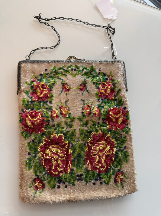 1920s vintage beaded flapper bag with silver metal hardware. Red, yellow, pink and green flower design.