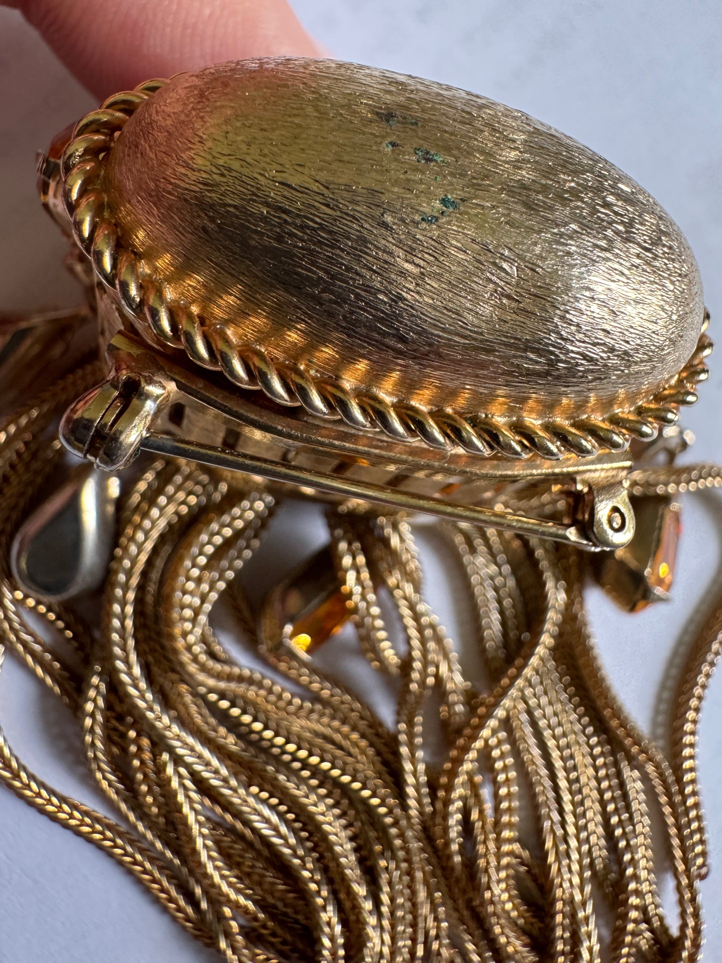 Joseff of Hollywood gold brooch with domed top and cascades of 13 prong set large citrine glass teardrops and 5 round white glass rhinestones w/ tassels.Unsigned Joseff of Hollywood was created for a specific actress for a specific film.