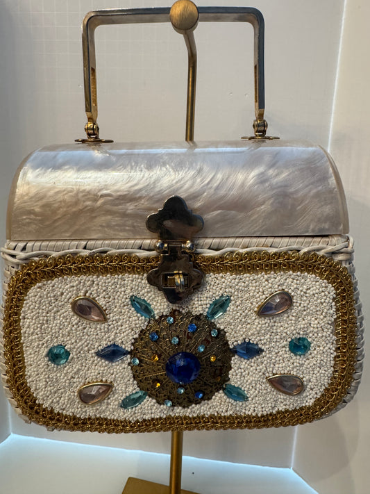 This top handle 1950s bag is a real showstopper. White wicker Lucite top square gold handle beads, and rhinestones in beautiful condition.