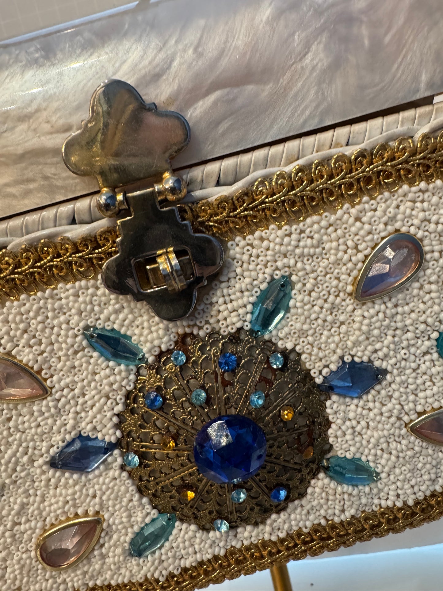 This top handle 1950s bag is a real showstopper. White wicker Lucite top square gold handle beads, and rhinestones in beautiful condition.