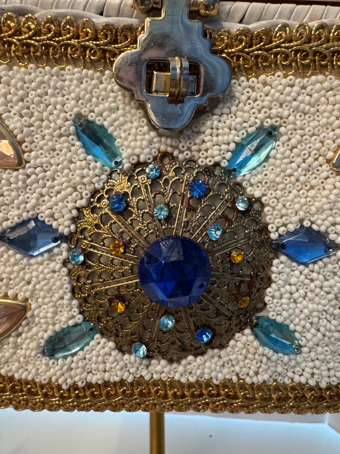 This top handle 1950s bag is a real showstopper. White wicker Lucite top square gold handle beads, and rhinestones in beautiful condition.