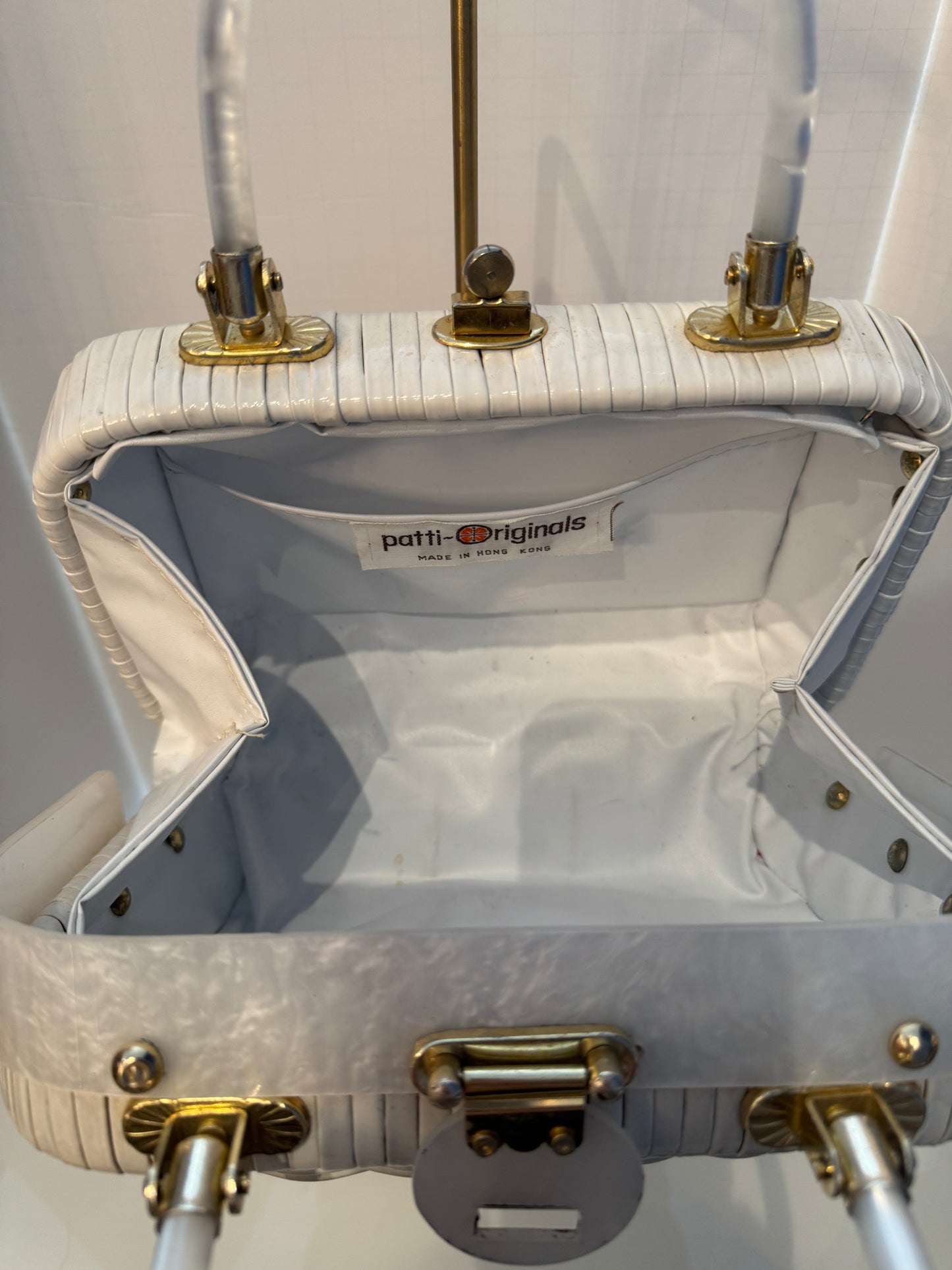Absolutely beautiful 1950s top handle, wicker and Lucite bag. Handles and front are loose site with gold hardware back is all wicker.