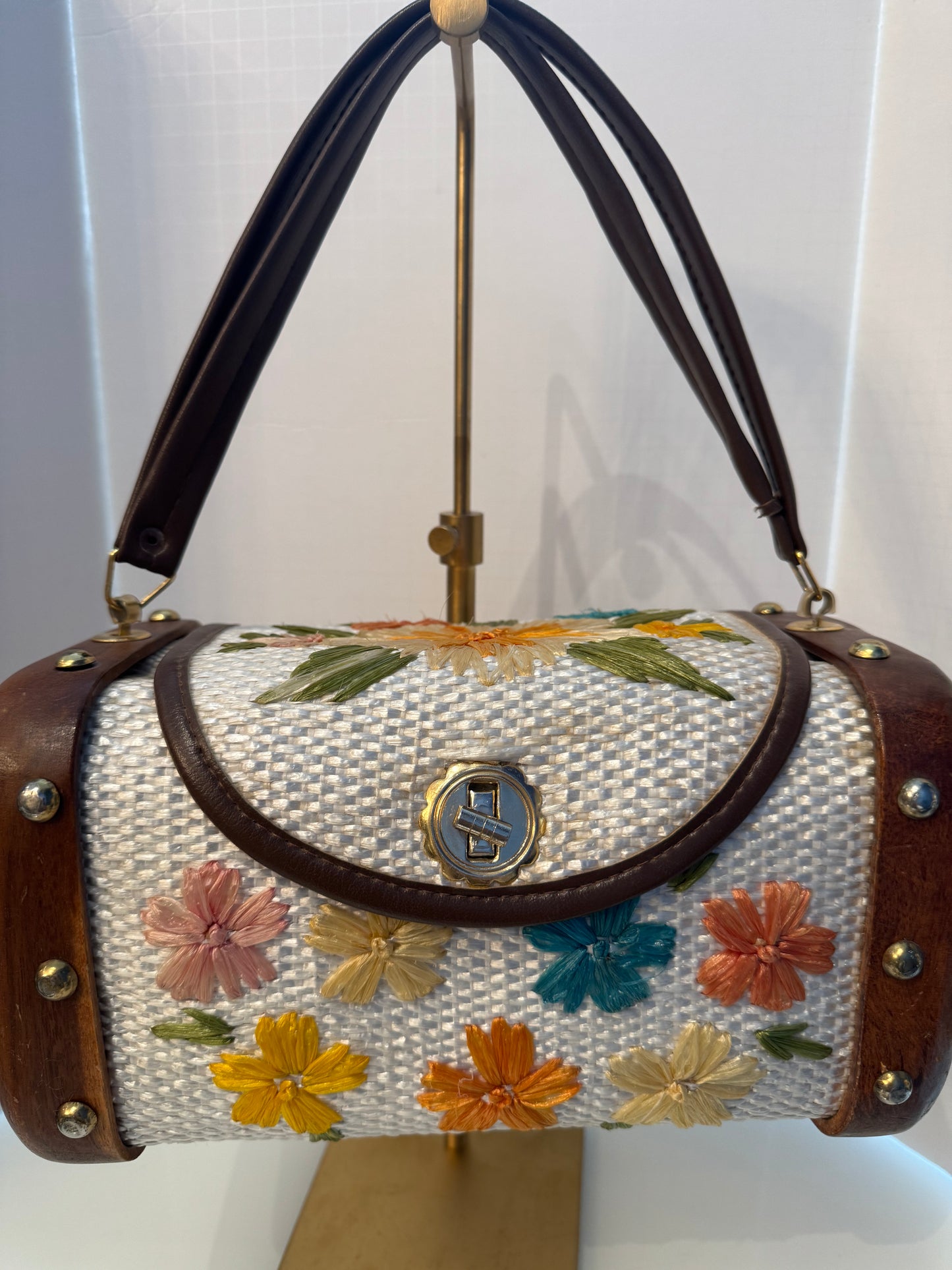 Gorgeous 1950s ivory, wicker, and wood top handle bag with embroidered flowers and gold hardware