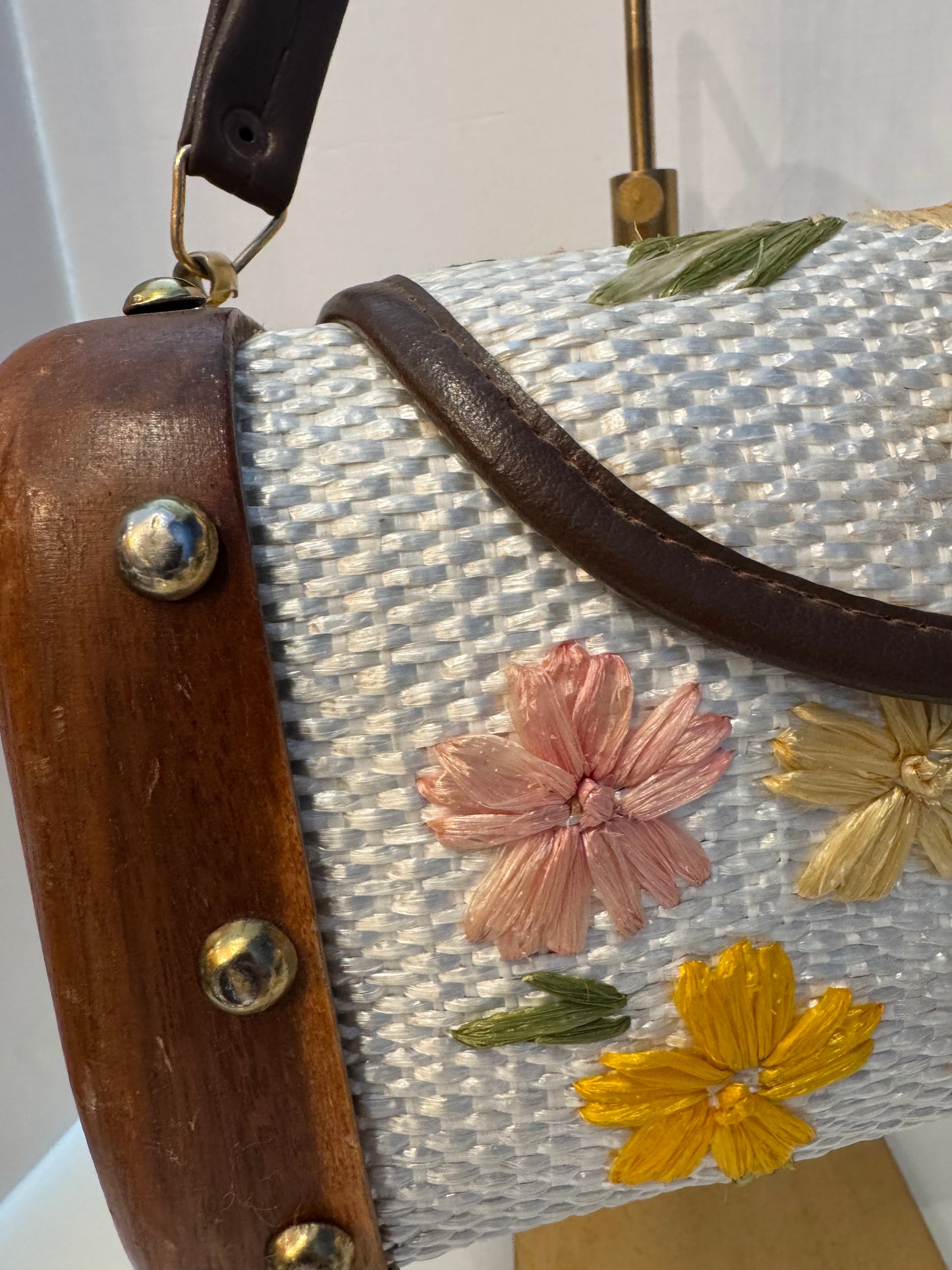 Gorgeous 1950s ivory, wicker, and wood top handle bag with embroidered flowers and gold hardware