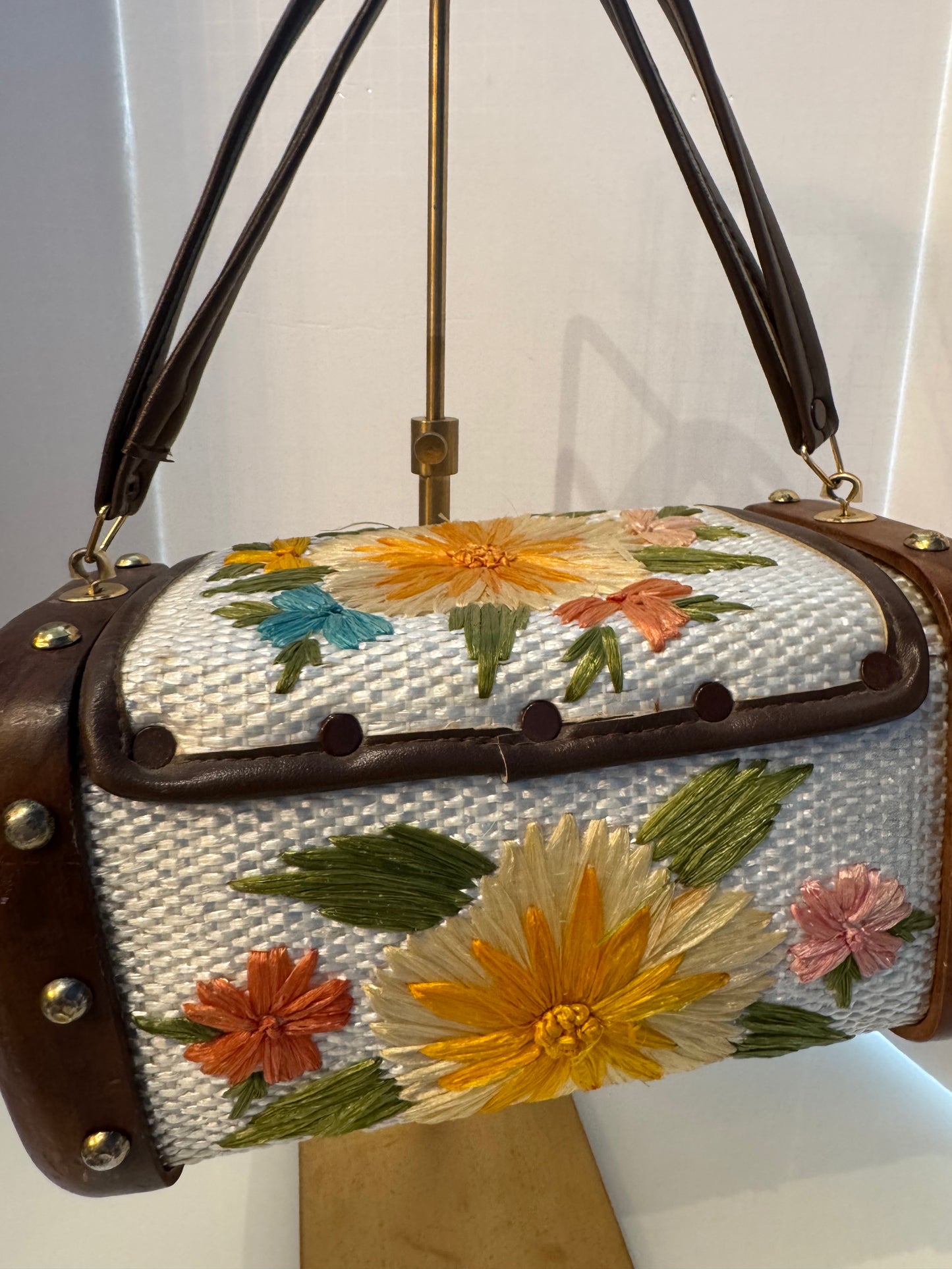 Gorgeous 1950s ivory, wicker, and wood top handle bag with embroidered flowers and gold hardware