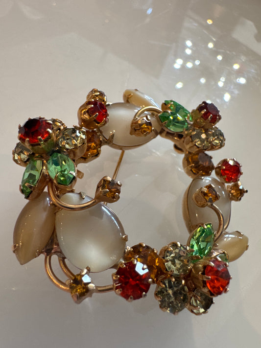 Stunning 1950s wreath brooch with milk, glass, moonstones, and layered petals made out of colored rhinestones