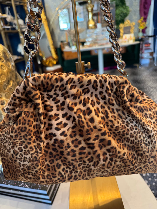 Exclusive Limited Edition Vavra New York bag collection. This  leopard print (small print) fabric bag converts from clutch to shoulder strap with chunky chain shown. Black lining with interior pocket.