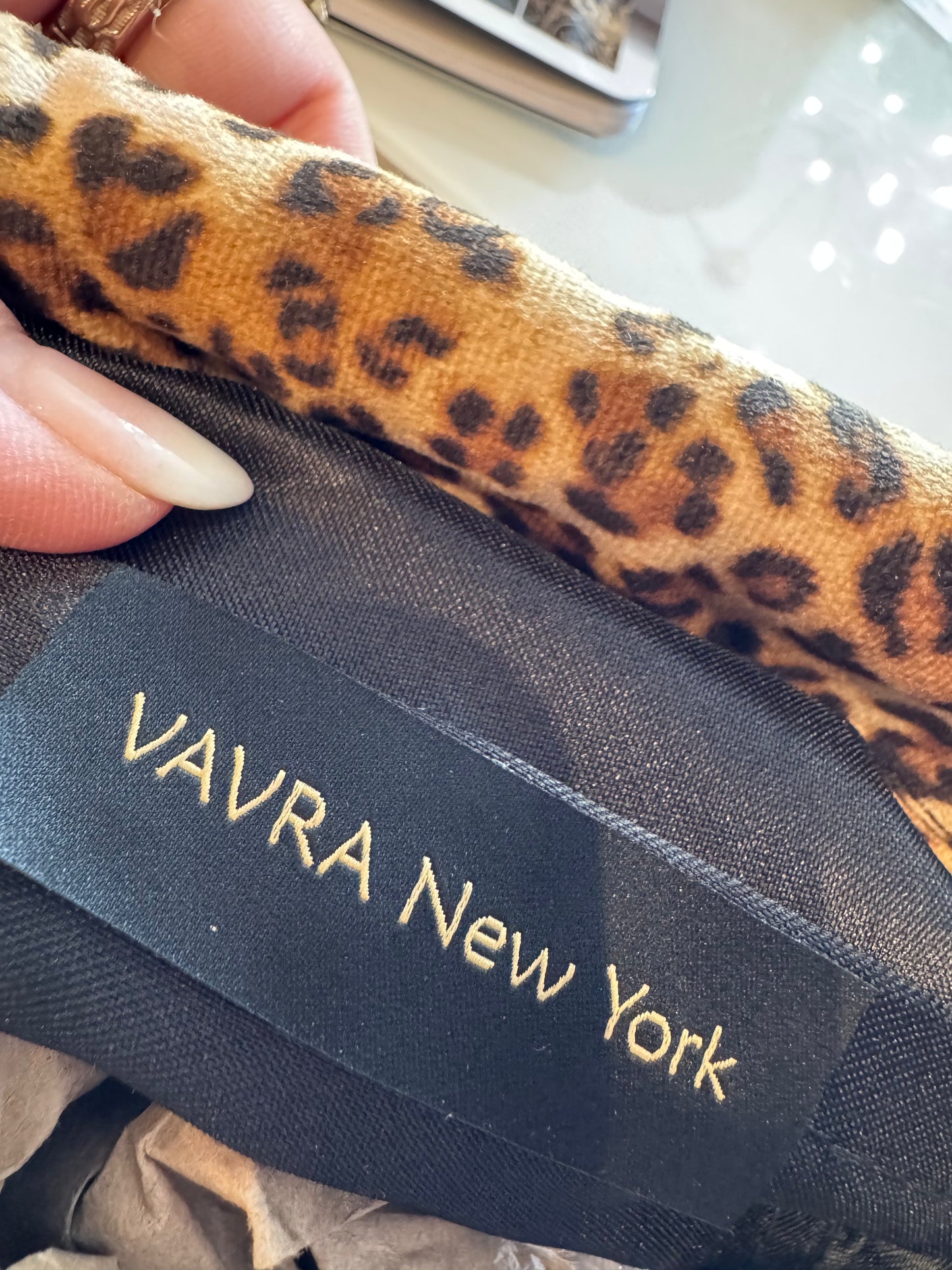 Exclusive Limited Edition Vavra New York bag collection. This leopard print (small print) fabric bag converts from clutch to shoulder strap with chunky chain shown. Black lining with interior pocket.