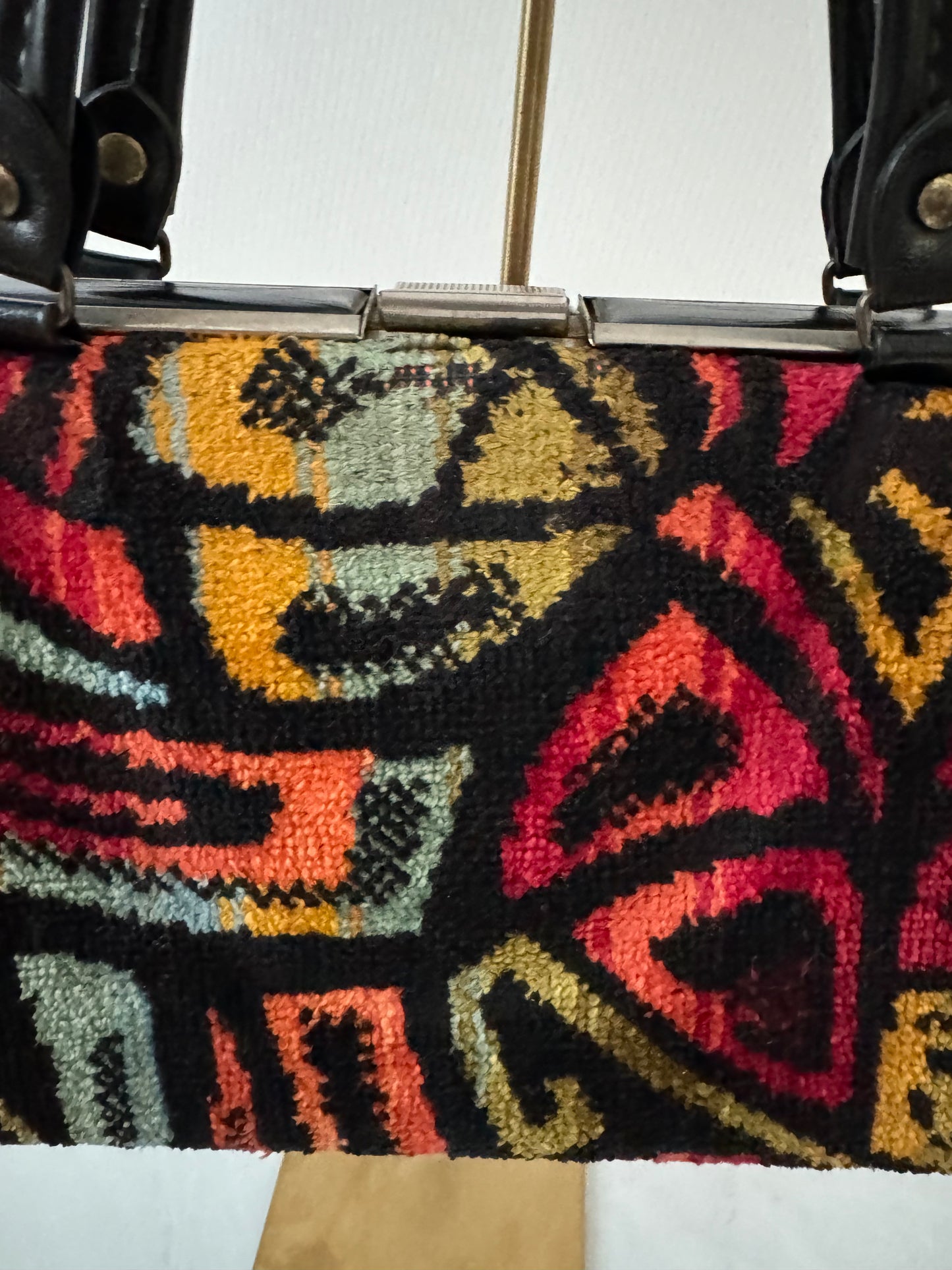 Vintage 1950s colorful black leather top handle handbag