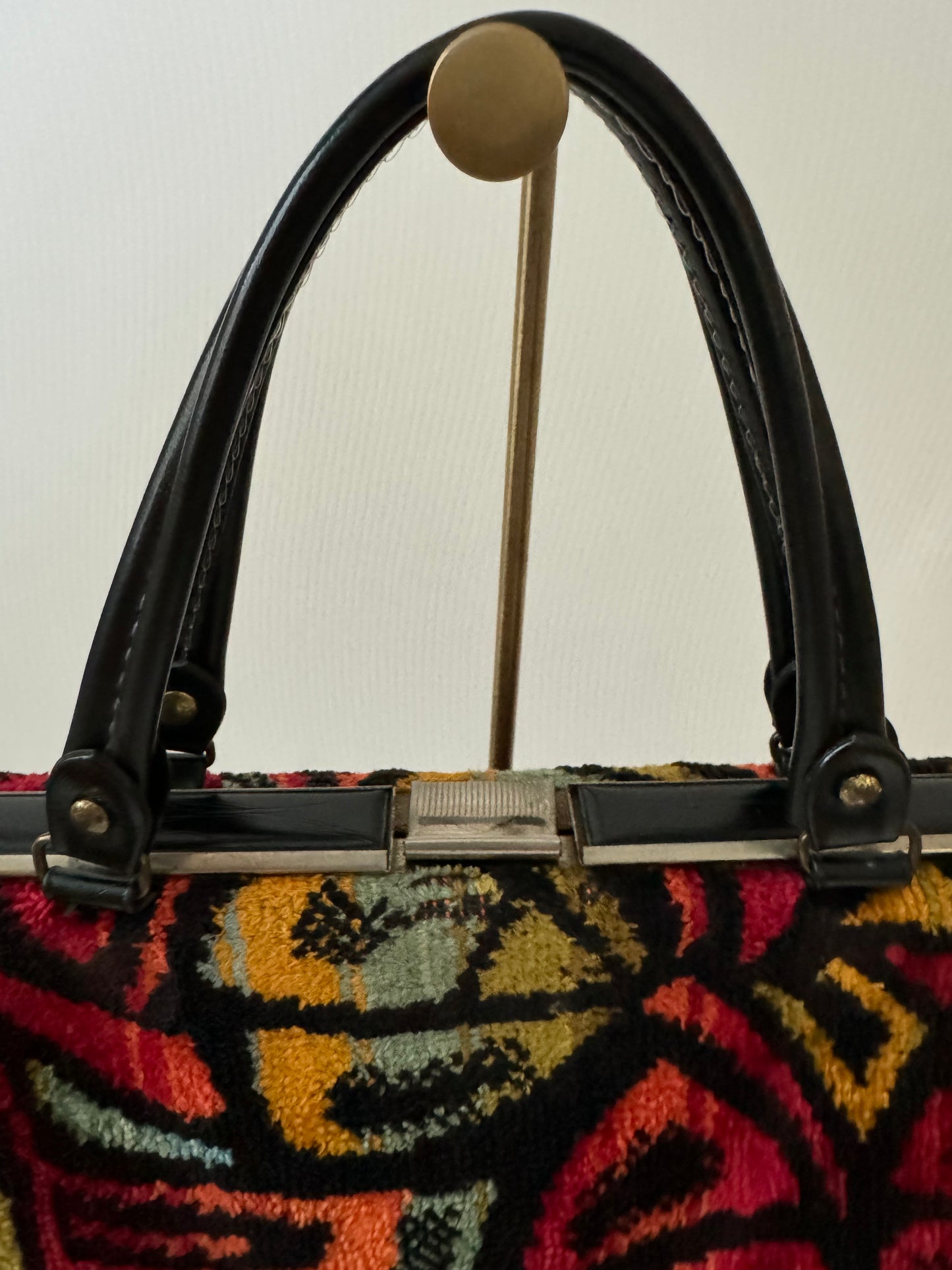 Vintage 1950s colorful black leather top handle handbag