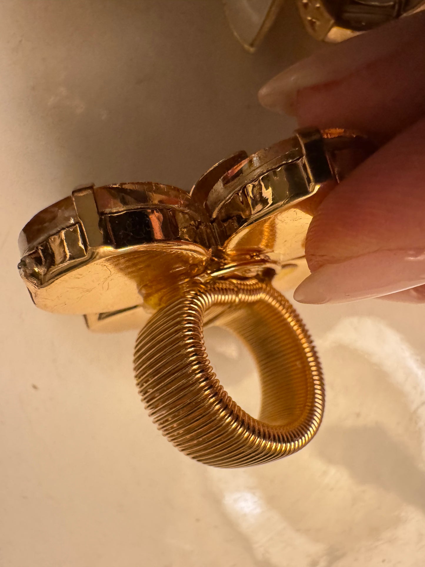 Beautiful 1980s rhinestone amber colored flowering with gold center flower. Sourced in Paris.