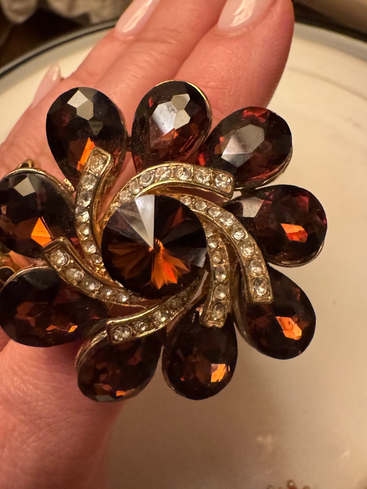 Beautiful 1980s Amber colored flower with rhinestone center ring. Sourced in Paris.