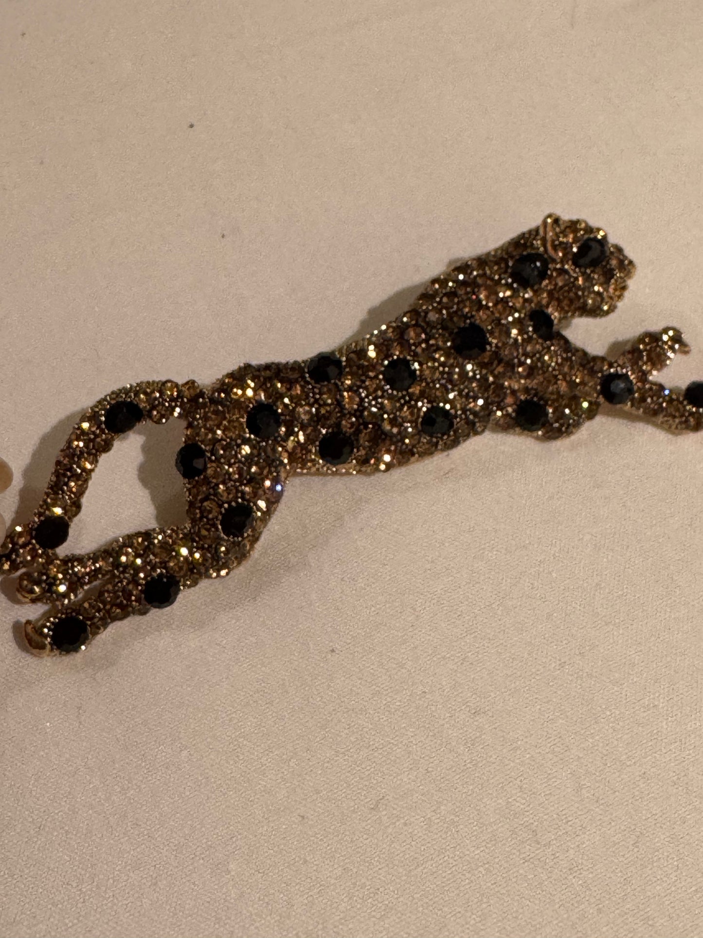 vintage 1980s sleek panther rhinestone brooch. Sourced in Paris.