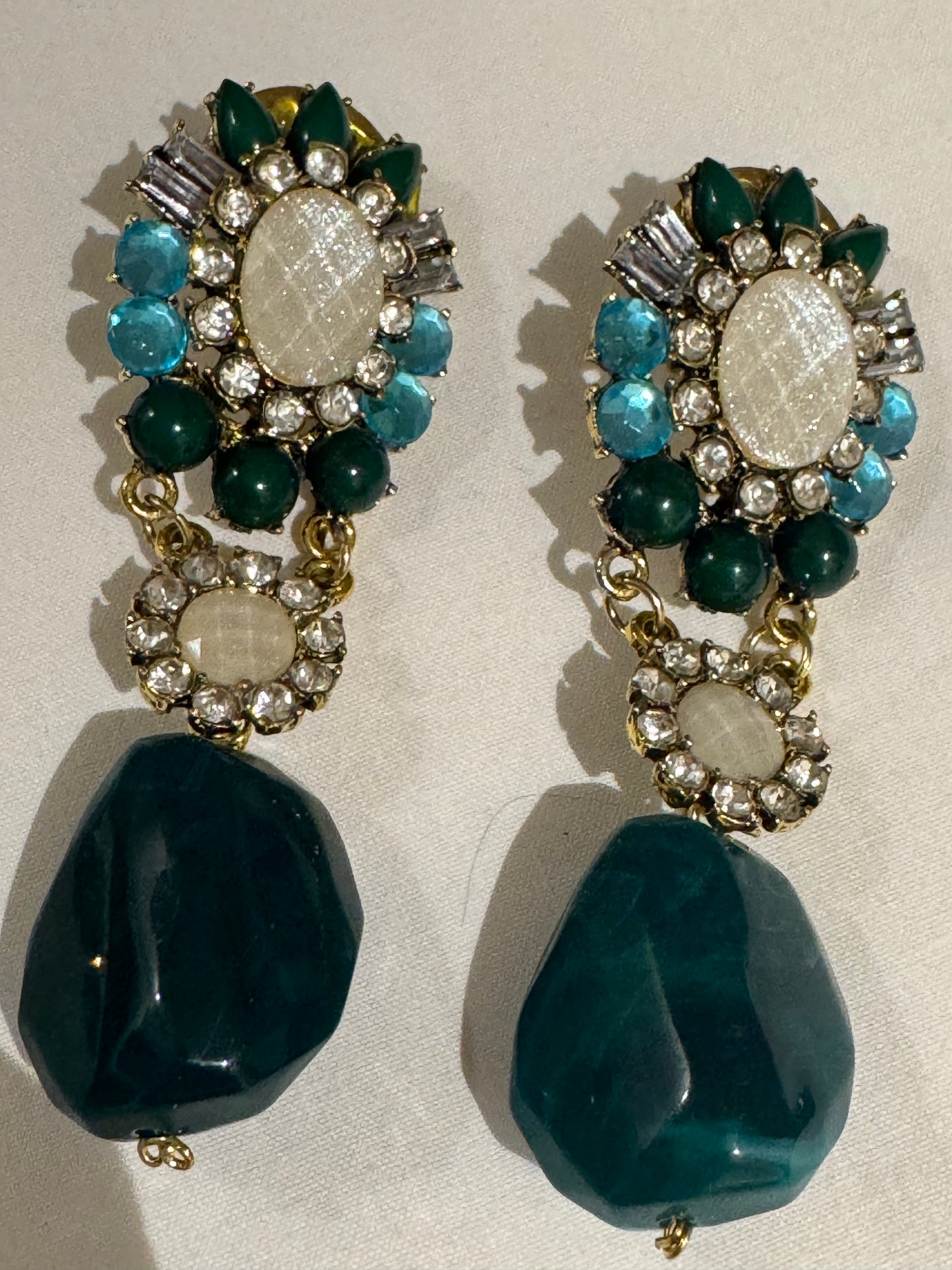 Absolutely stunning 1980s vintage jumbo drop earrings with green blue and clear rhinestones. Sourced in Paris.