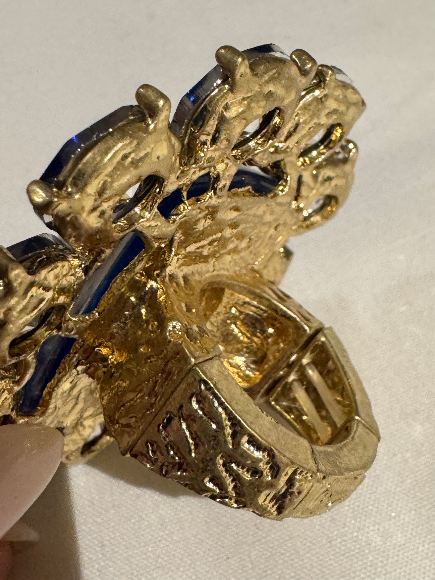 Jumbo 1980s cocktail ring with blue flower rhinestones and center multicolored stone. Sourced in Paris.