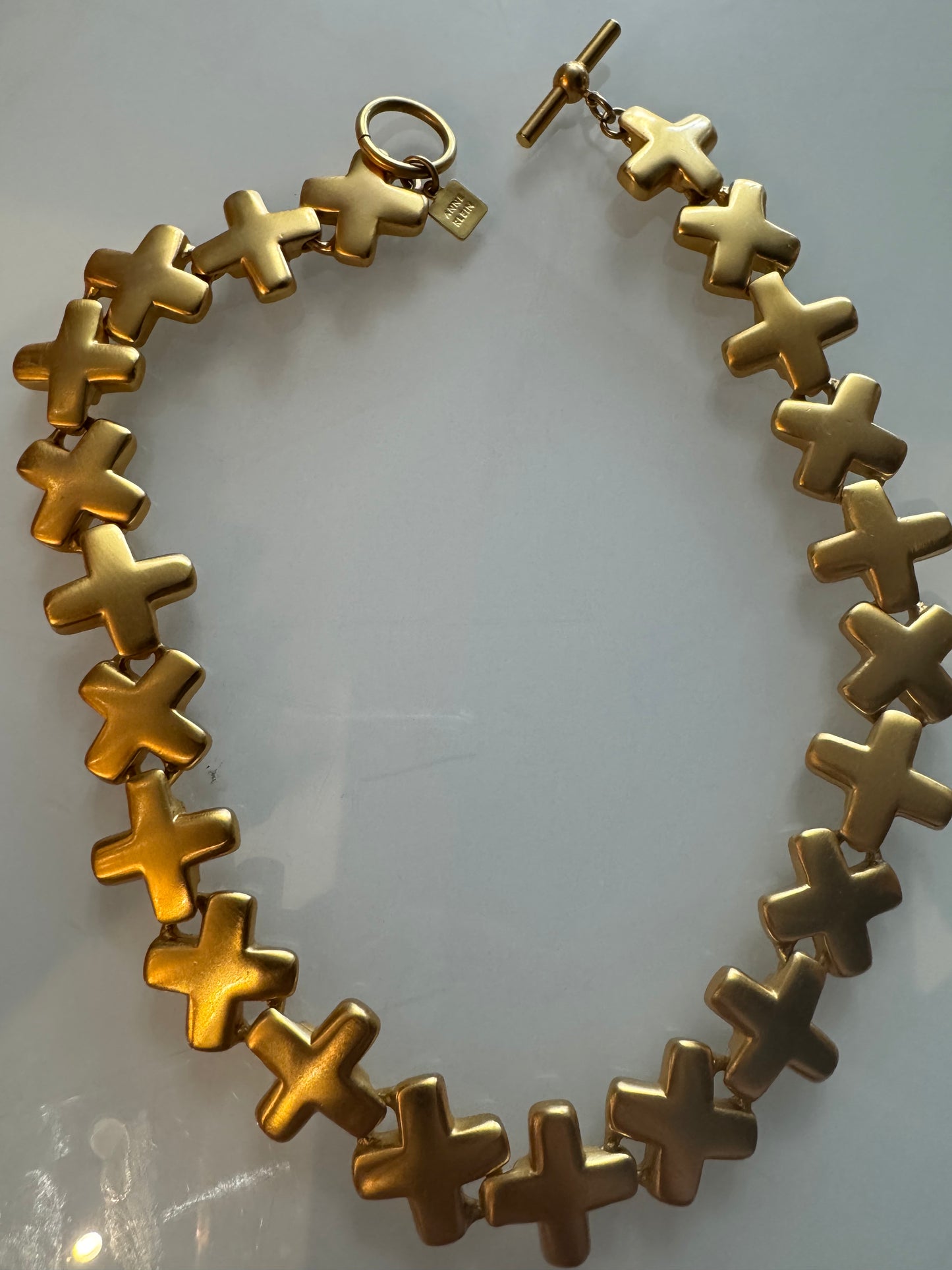 1980s Ann Klein, matte Gold tone X necklace