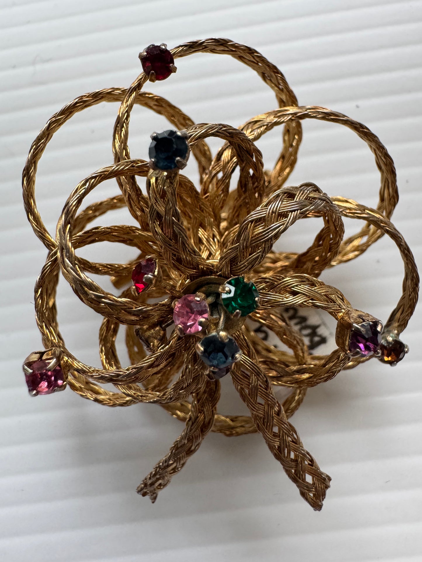 Vintage gold tone, braided bow brooch with colored rhinestones