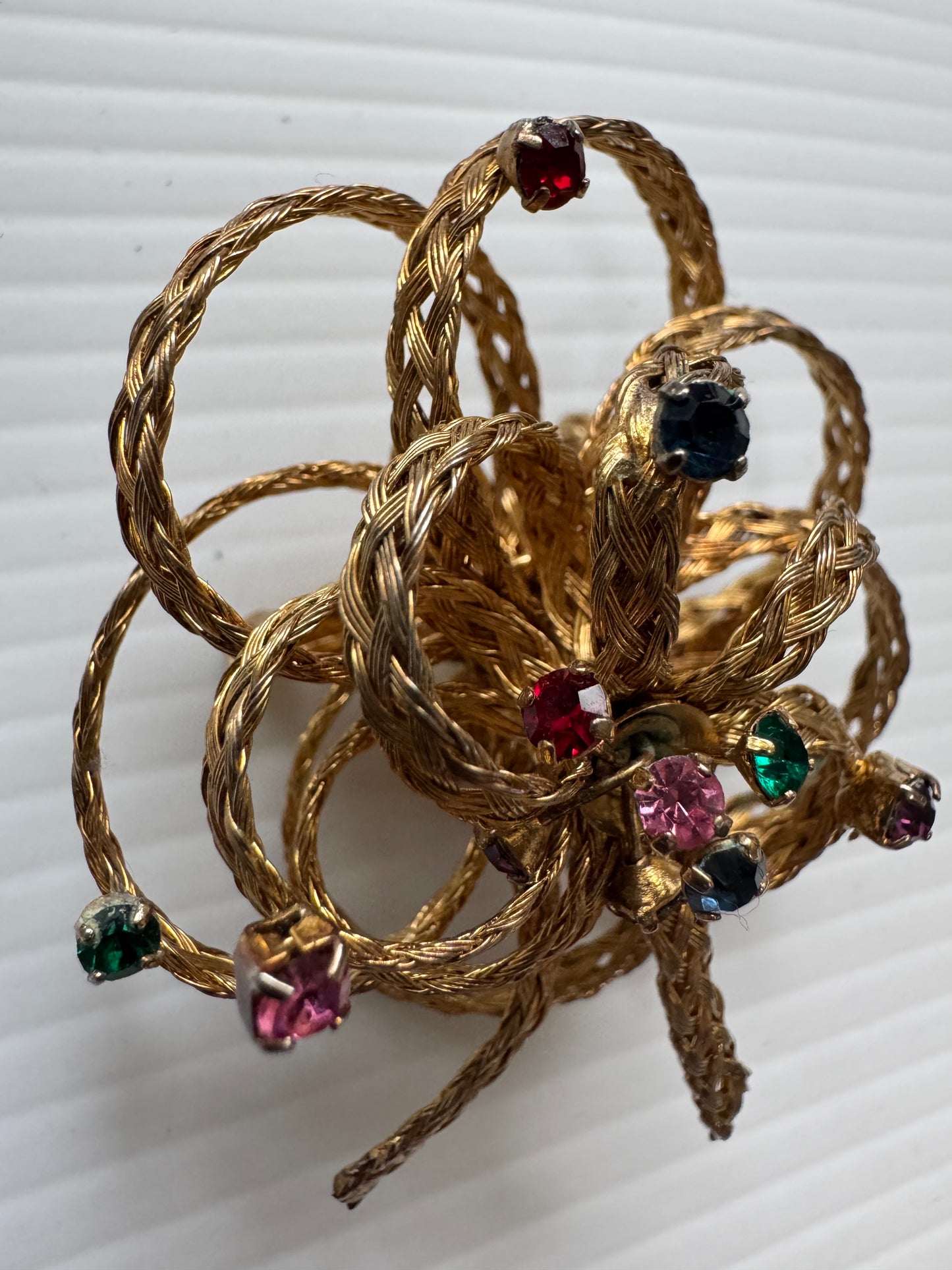 Vintage gold tone, braided bow brooch with colored rhinestones