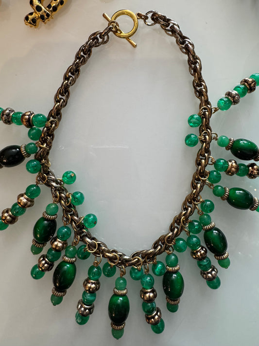 Beautiful vintage statement piece in gold tone with greens dangling stones