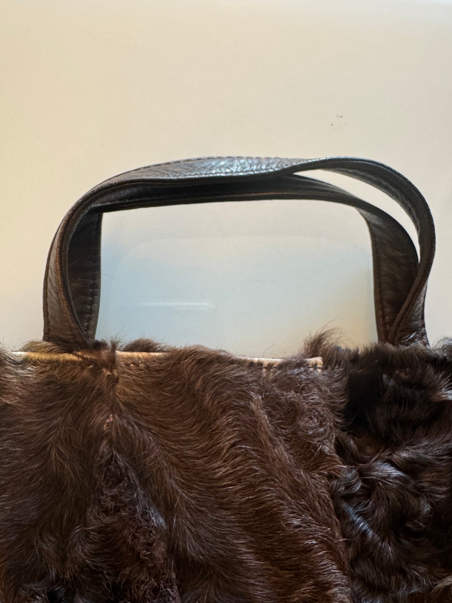 Vintage Loewe fur tote in brown with leather handles, back. Inside zip