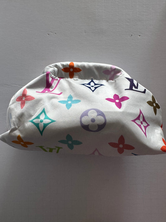 Vintage small silk scarf reimagined as a clutch bag. Comes with optional crossbody chain