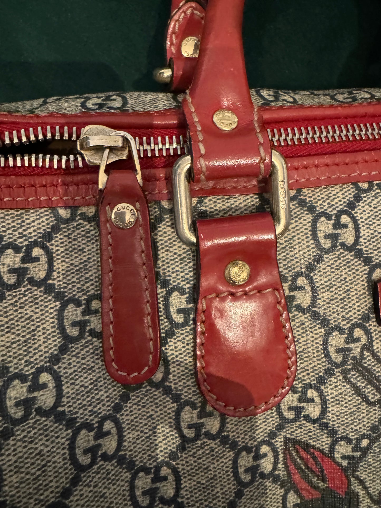 Pre-loved Gucci Boston Joy Tattoo Heart canvas with red leather top handle handbag. Comes with dust bag. Interior needs a little cleaning.
