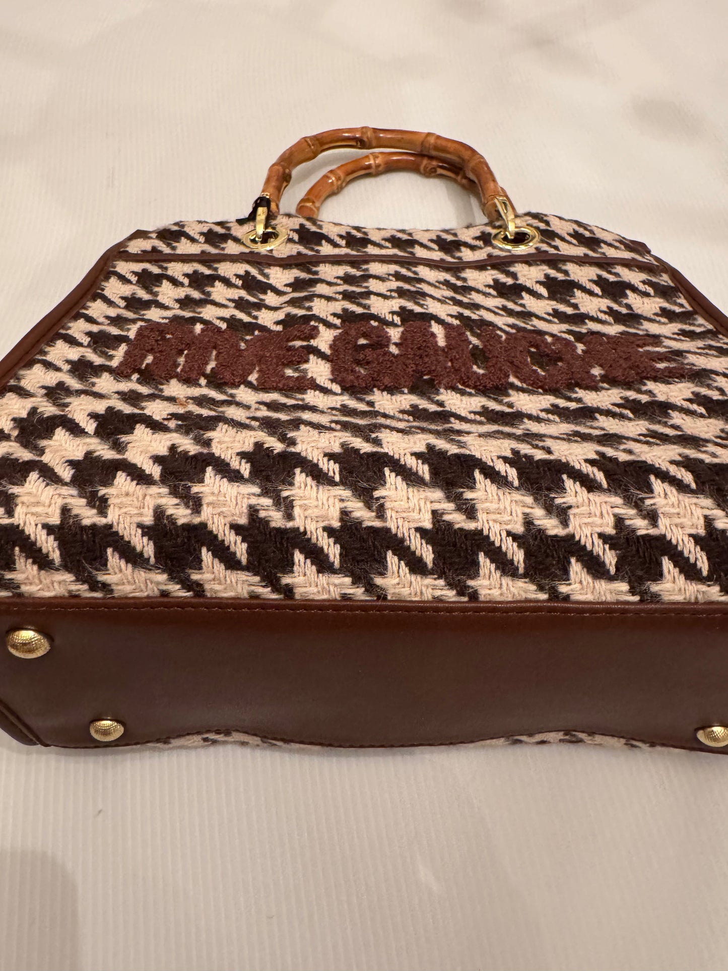 Beautiful, small black and white herringbone fabric handbag with bamboo handles, optional Crossbody strap and vegan leather and writing in  brown.