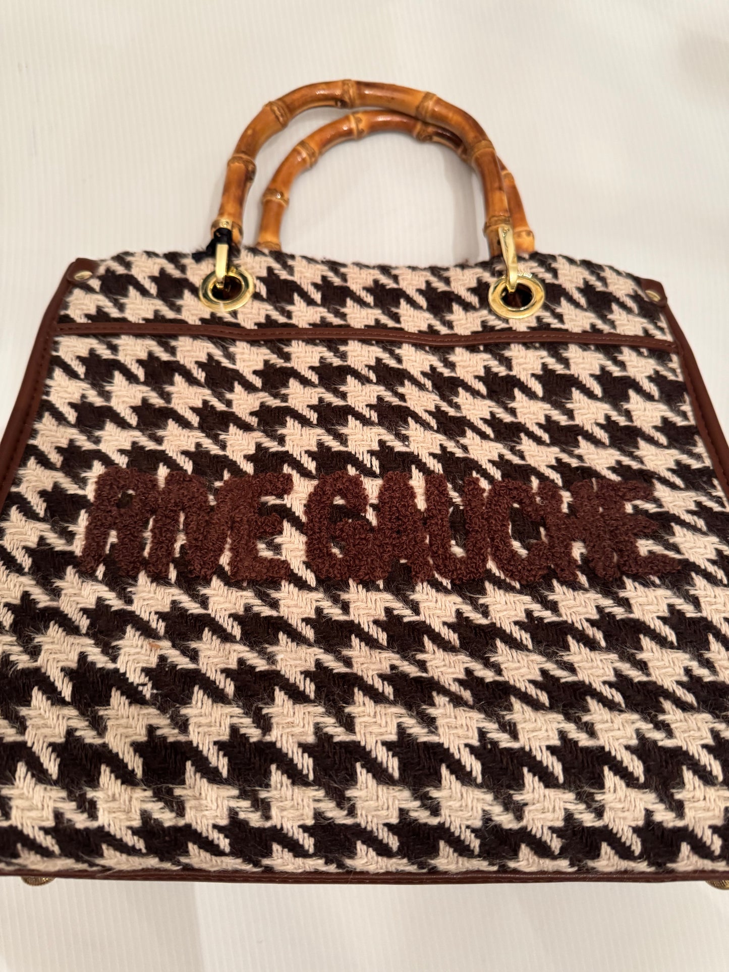 Beautiful, small black and white herringbone fabric handbag with bamboo handles, optional Crossbody strap and vegan leather and writing in  brown.