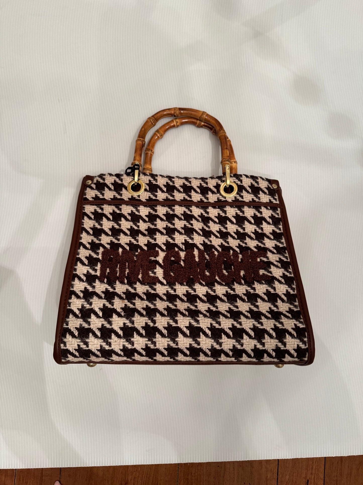 Beautiful, small black and white herringbone fabric handbag with bamboo handles, optional Crossbody strap and vegan leather and writing in  brown.