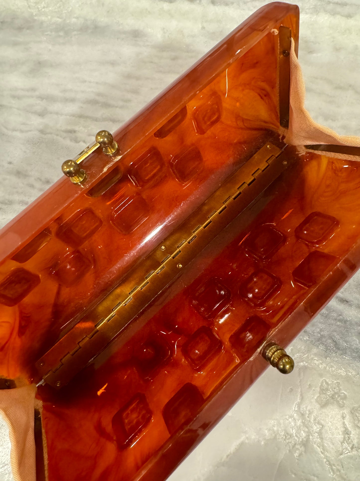 1940s tortoise lucite clutch with rhinestone detail (loose clasp 2 stones missing) Sold as is.