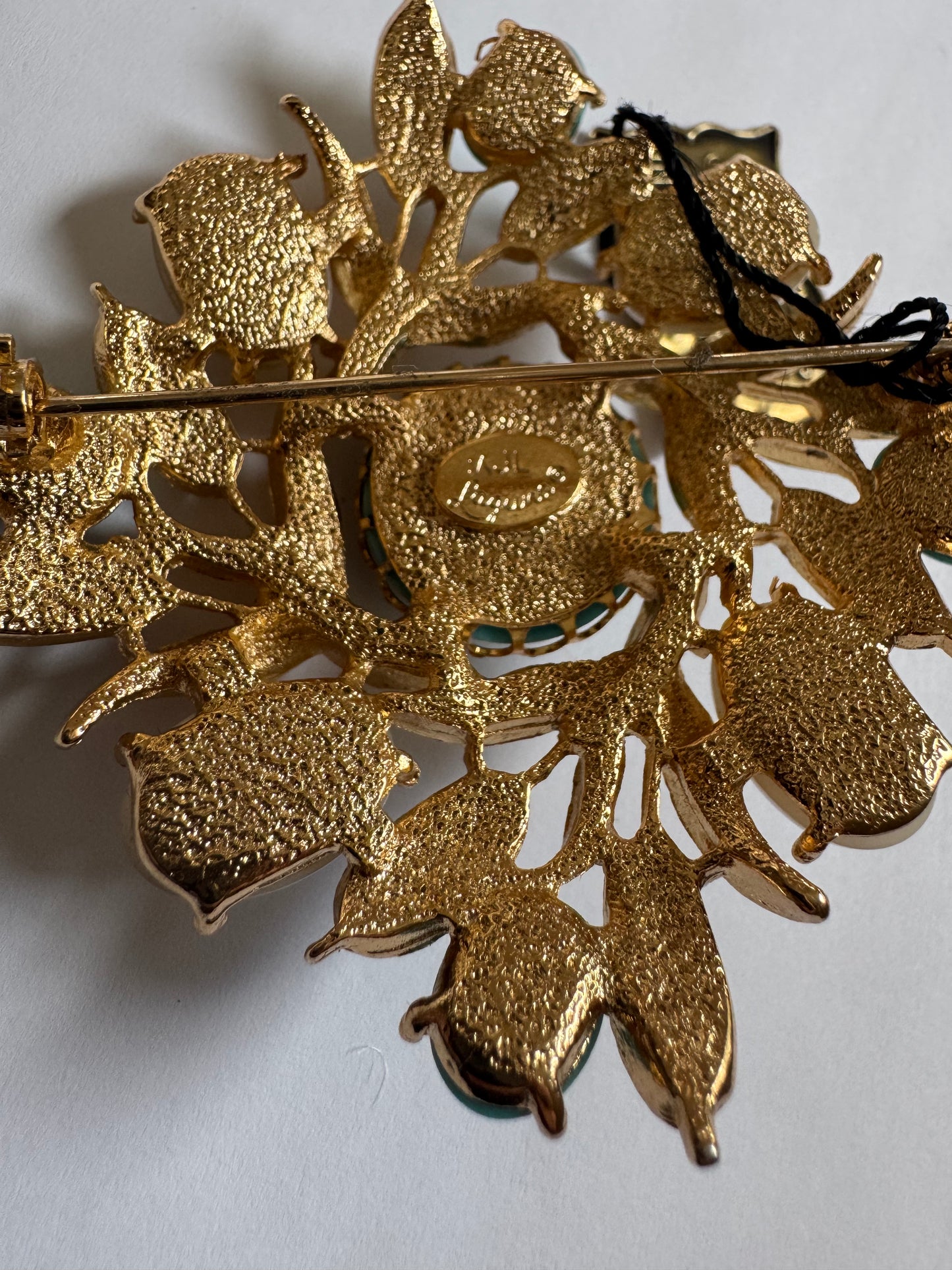 1960s vintage signed KJL Laguna gold tone, brooch with turquoise and faux pearl cabochon and clear rhinestones. Original tag attached.