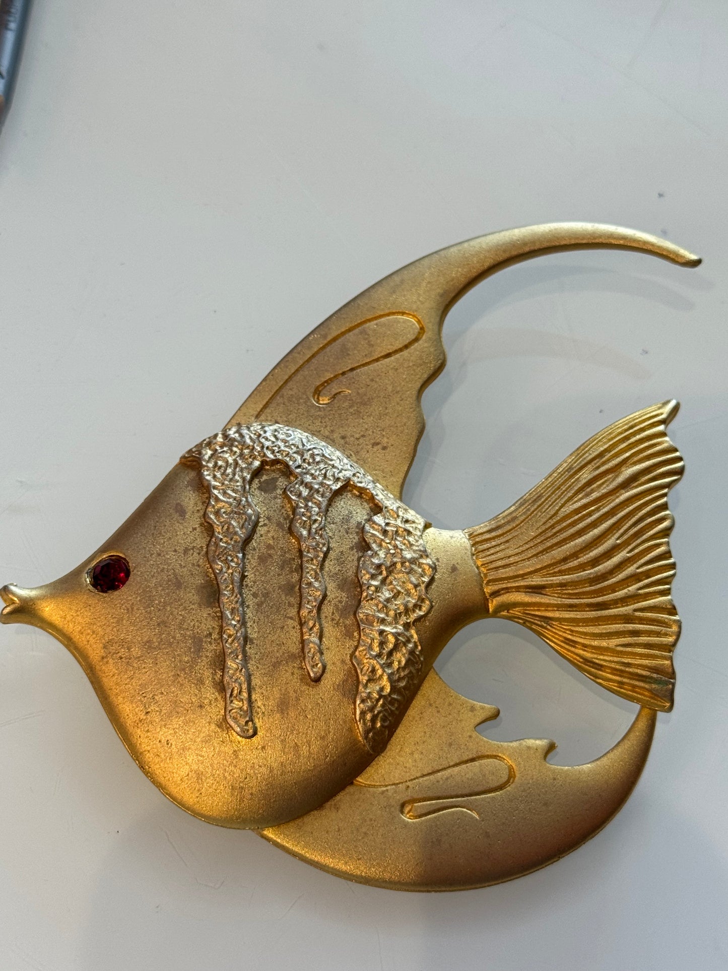 Adorable jumbo 1980s angelfish pendant with red rhinestone eye. Edit to any chain or choker for a fabulous statement piece.