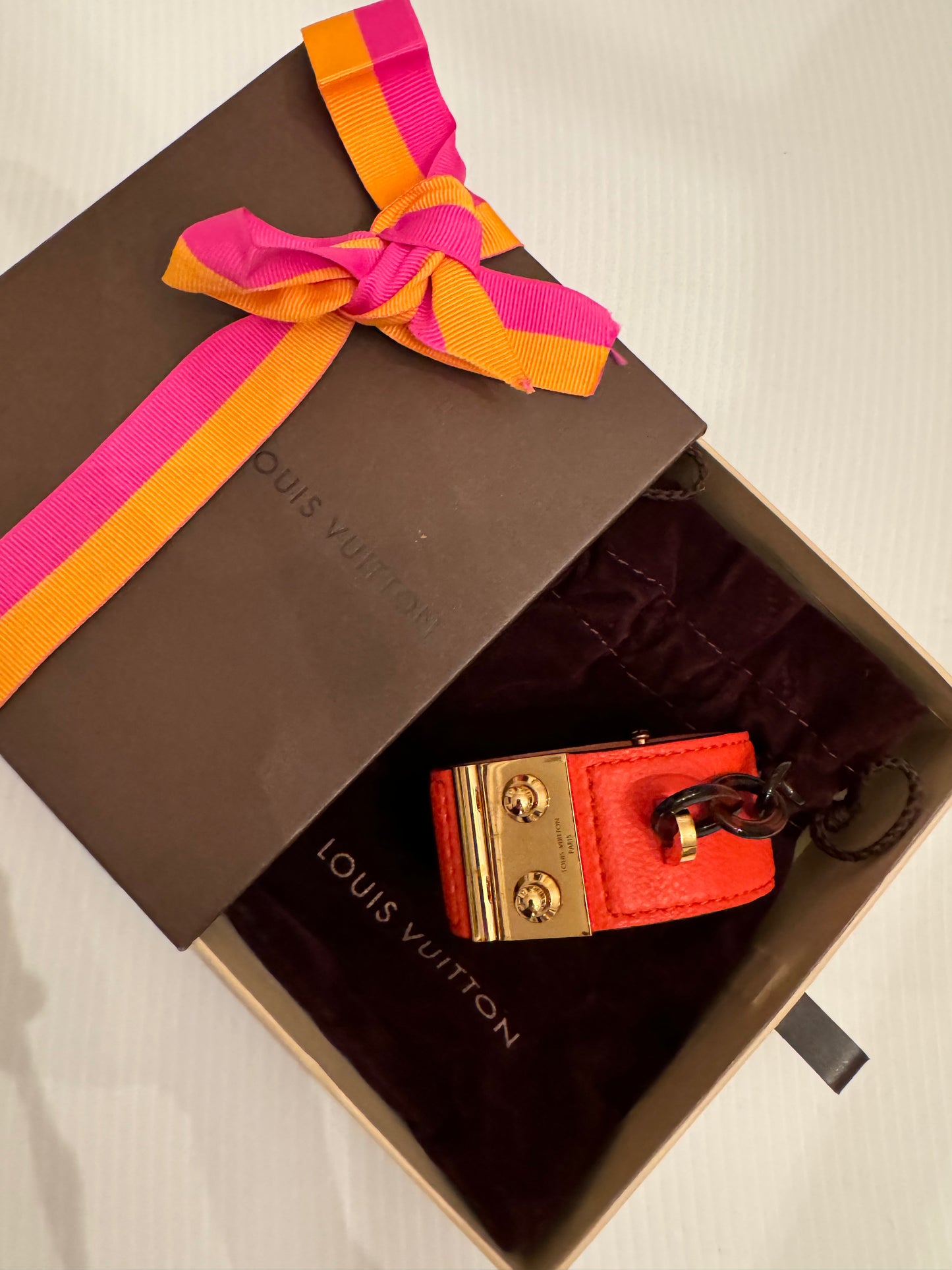 Vintage Louis Vuitton Lock Me red leather bracelet in gold plate and brass. Never worn