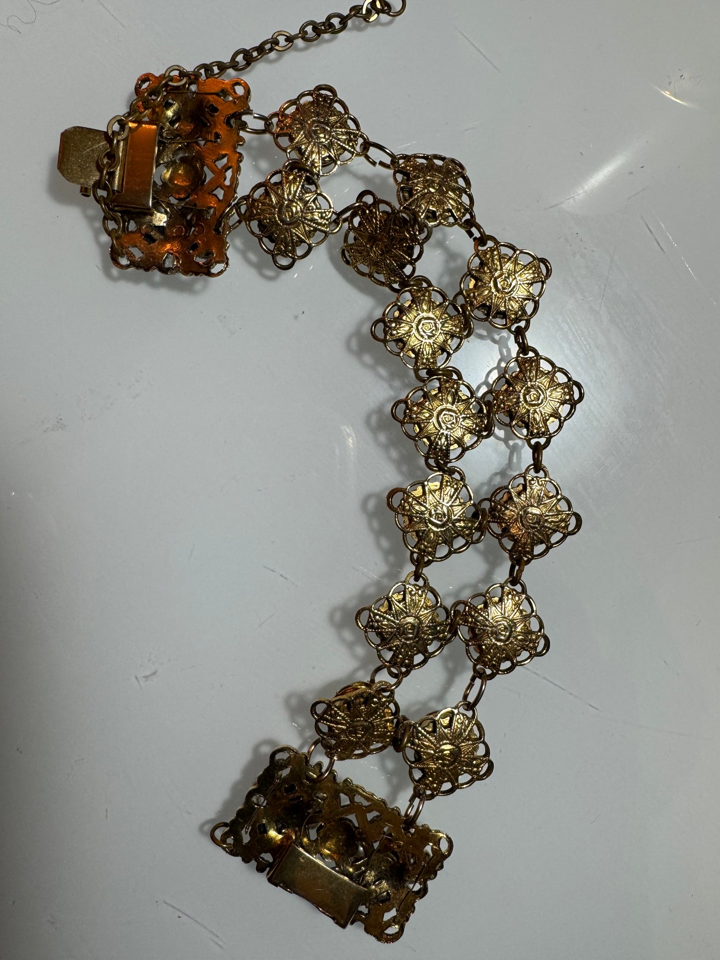 Double stranded 1940s gold tone filagree with rhinestone bracelet. Oscar worthy!