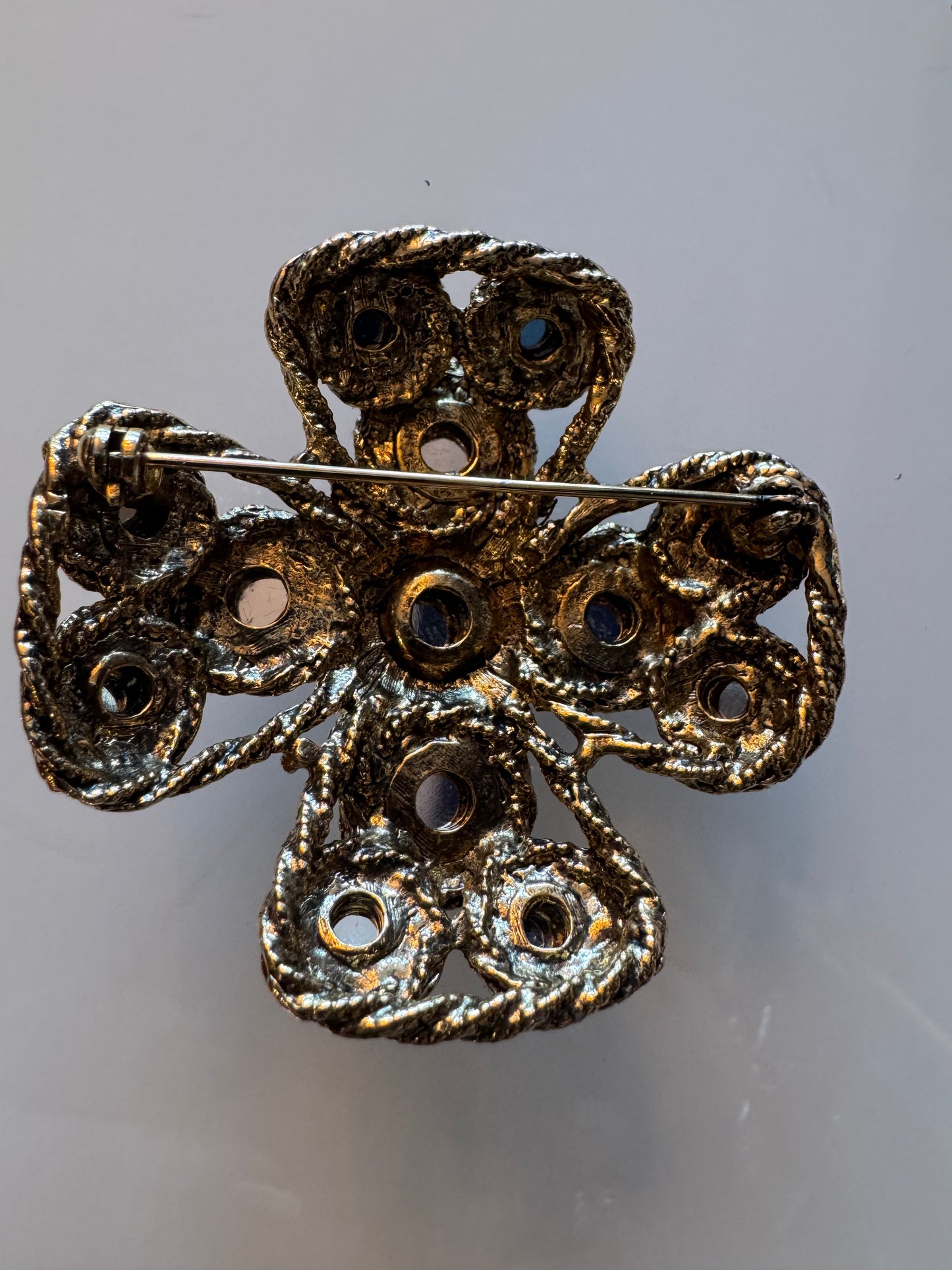 1980s gold tone and multi colored rhinestone brooch